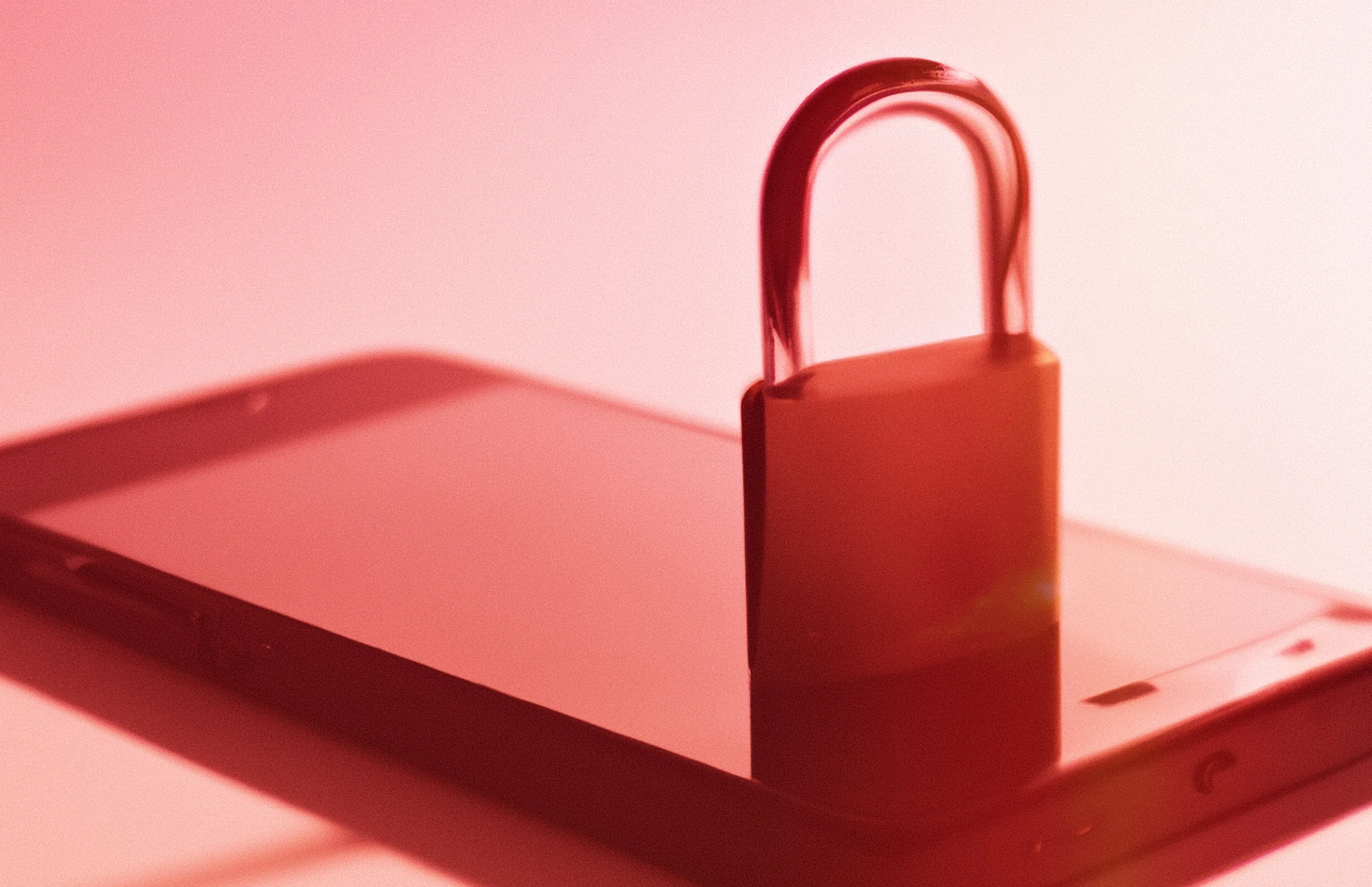 A DALL·E 2 render of a phone with a padlock on top of it.